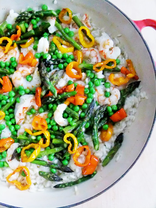 shrimp risotto with asparagus, peas and peppers