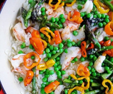 shrimp risotto with asparagus, peas and peppers